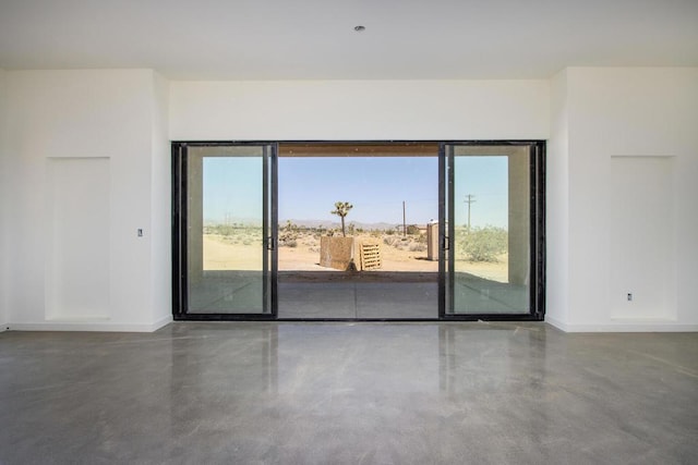 empty room featuring concrete flooring