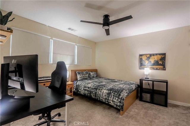 carpeted bedroom with ceiling fan, visible vents, and baseboards