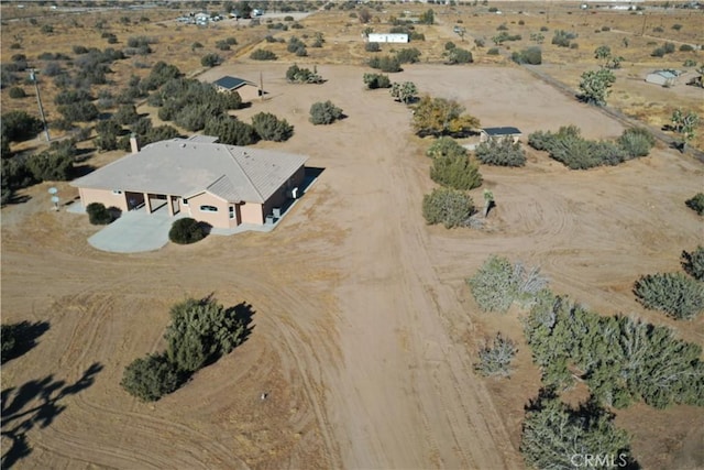 birds eye view of property featuring a rural view