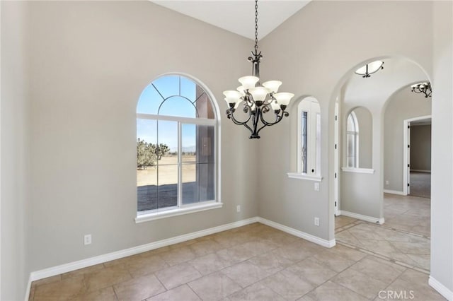 unfurnished dining area with lofted ceiling and a notable chandelier