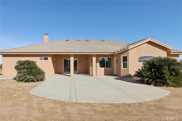 back of house featuring a patio