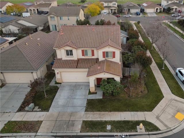 birds eye view of property with a residential view