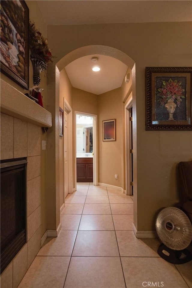 hall with light tile patterned floors