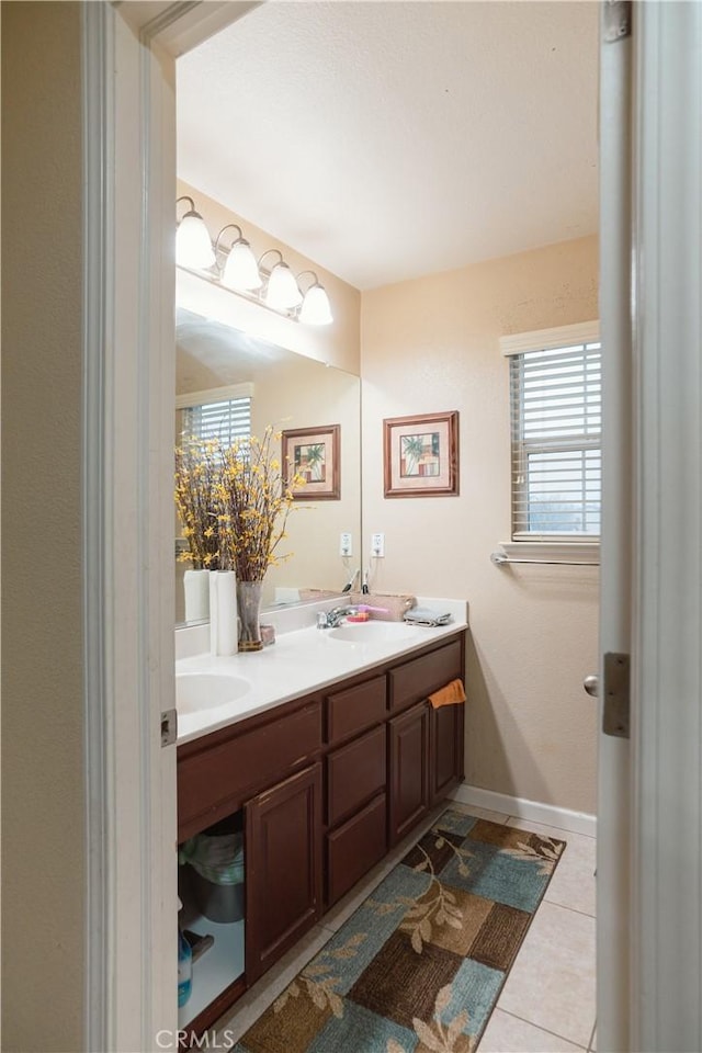 bathroom featuring tile patterned flooring and vanity