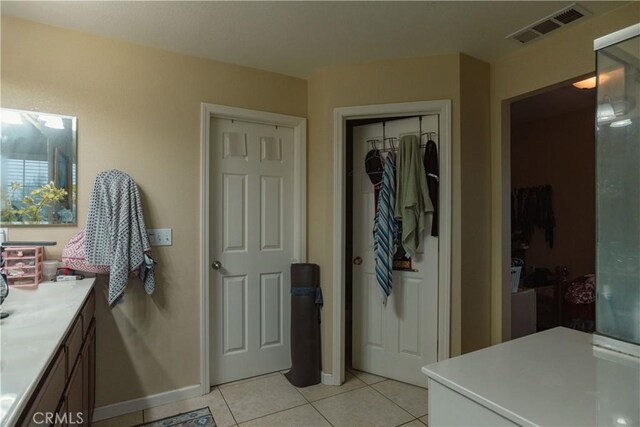 bathroom with vanity and tile patterned flooring