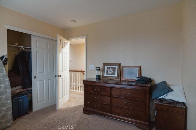 carpeted bedroom featuring a closet