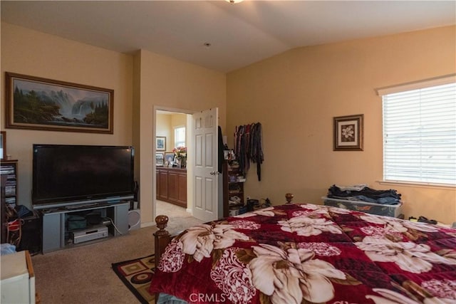 carpeted bedroom with vaulted ceiling