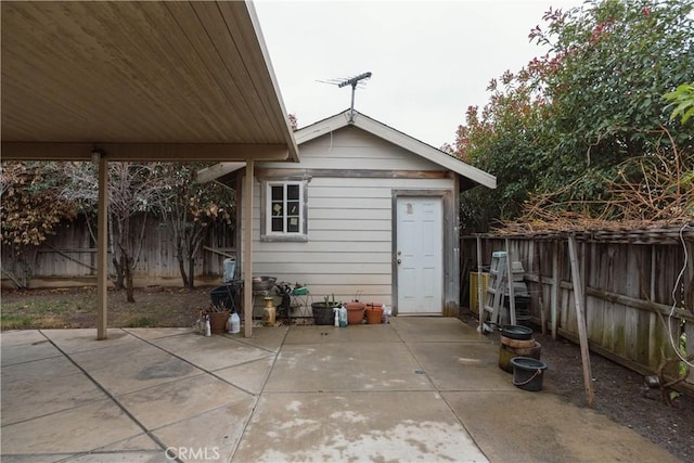 exterior space with a patio area and a fenced backyard