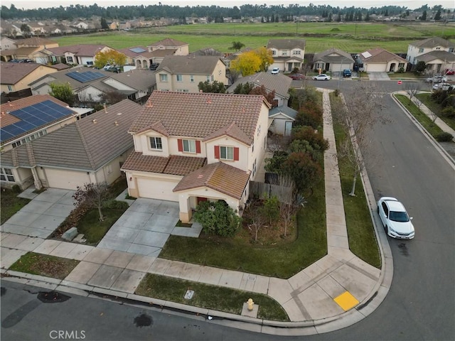 birds eye view of property with a residential view