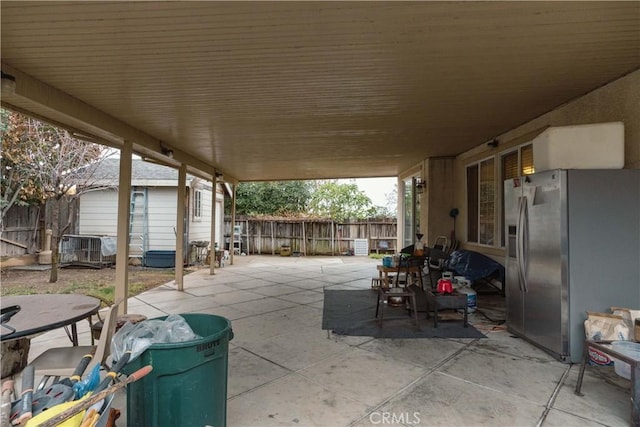 view of patio featuring a storage shed