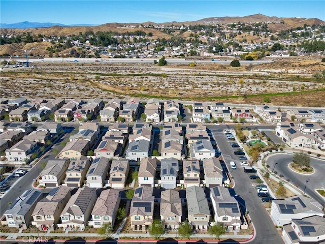 birds eye view of property with a mountain view