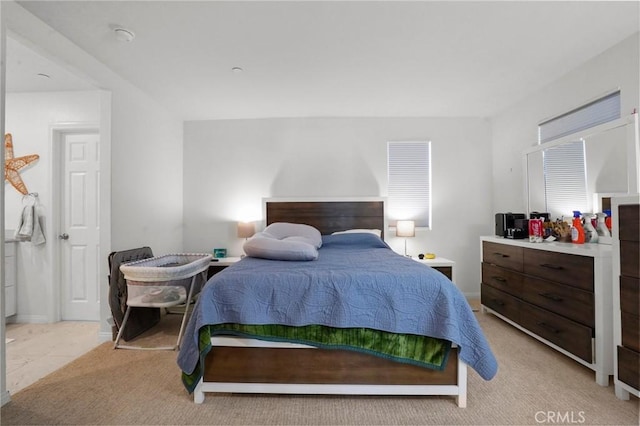 bedroom featuring light colored carpet