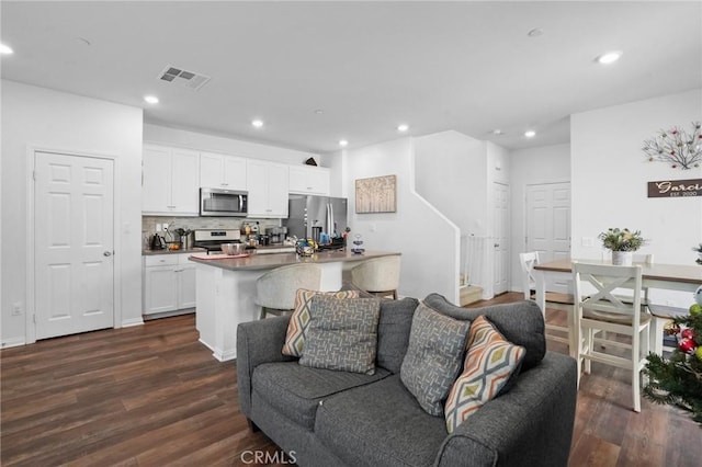 living room featuring dark hardwood / wood-style flooring