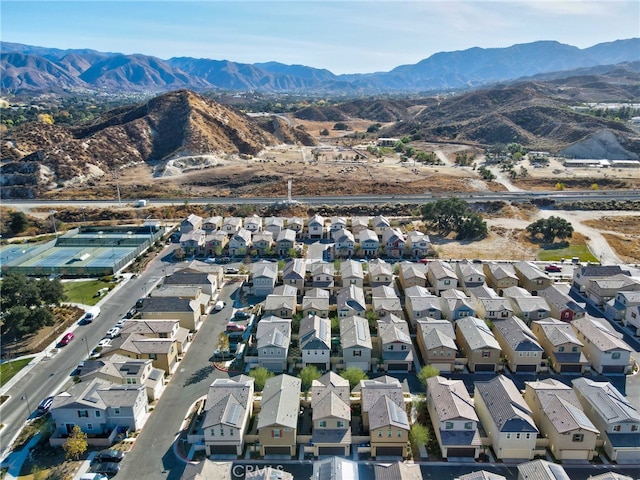 birds eye view of property with a mountain view