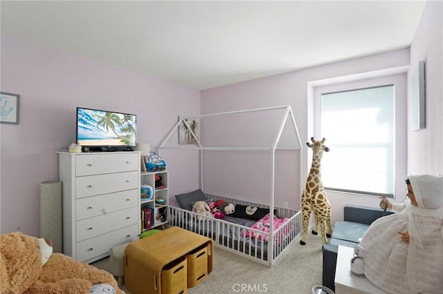 bedroom featuring a nursery area