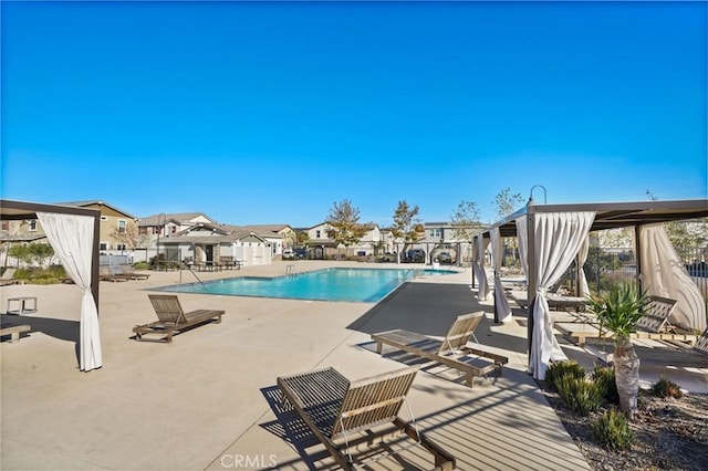 view of swimming pool with a gazebo and a patio