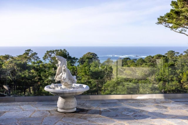 view of patio with a water view