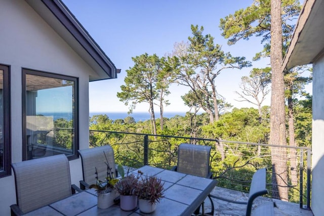 balcony featuring a water view