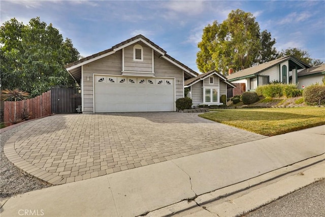 ranch-style home with a front yard and a garage