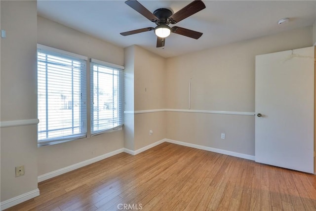 spare room featuring ceiling fan and light wood-type flooring