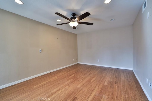 empty room featuring ceiling fan and light wood-type flooring