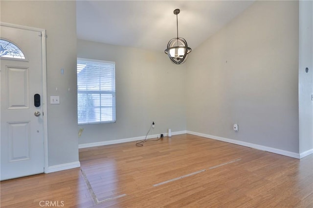 foyer featuring a wealth of natural light and light hardwood / wood-style flooring