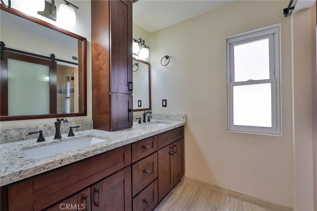 bathroom with a healthy amount of sunlight and vanity