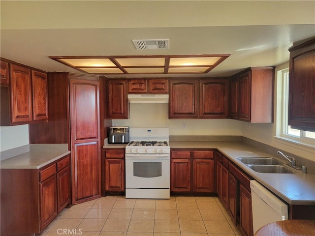 kitchen featuring light tile patterned flooring, sink, and white appliances