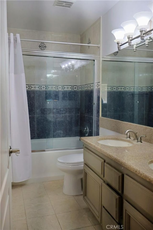 full bathroom featuring shower / tub combo with curtain, vanity, toilet, and tile patterned flooring