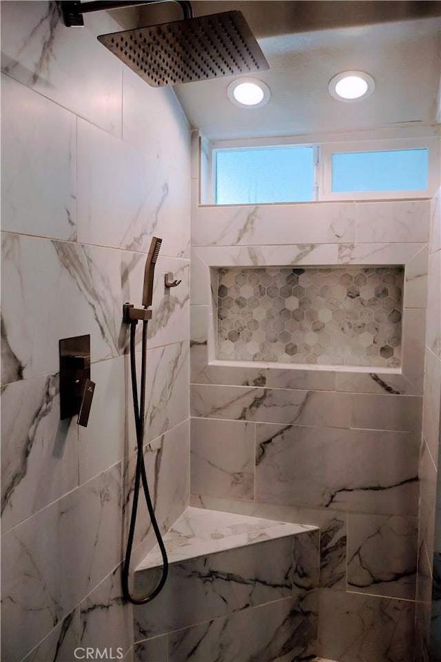 bathroom featuring tiled shower