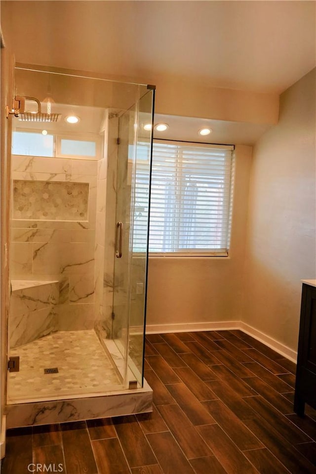 bathroom with an enclosed shower and vanity