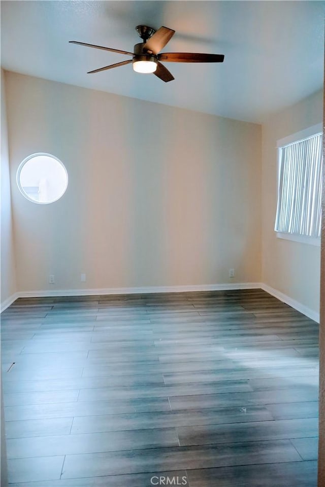 unfurnished room featuring hardwood / wood-style flooring and ceiling fan