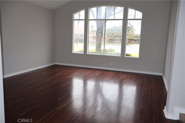 unfurnished room featuring dark hardwood / wood-style floors