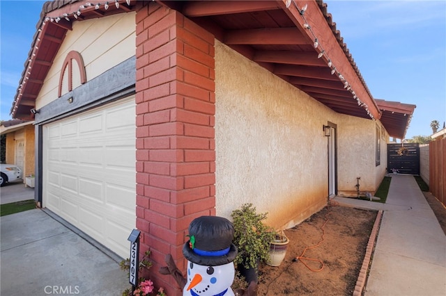 view of side of home featuring a garage