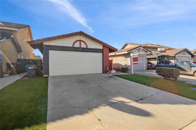 view of front of property featuring a front yard, a garage, and an outbuilding