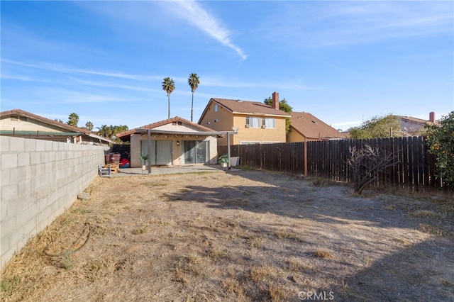 rear view of house with a patio