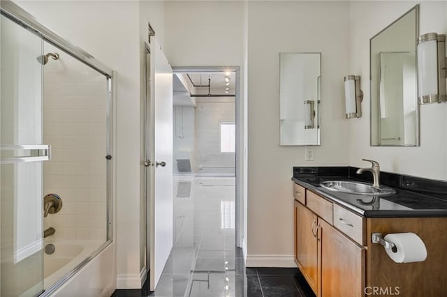 bathroom with enclosed tub / shower combo, tile patterned floors, and vanity