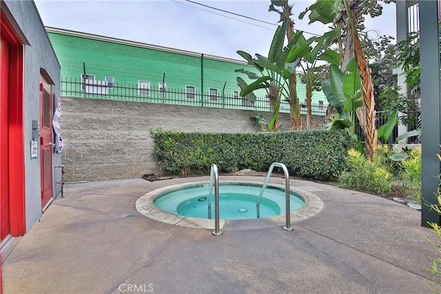 view of pool featuring a hot tub