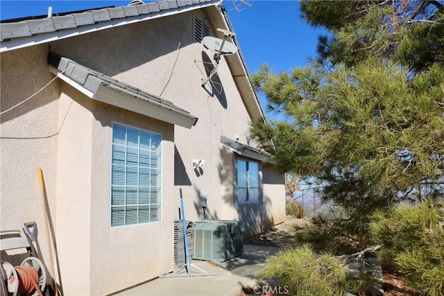 view of property exterior featuring central air condition unit