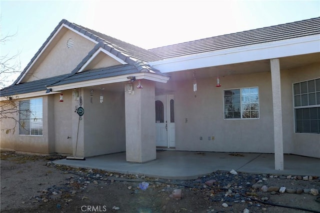 rear view of house featuring a patio area