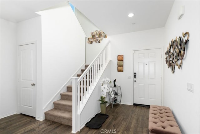 foyer entrance featuring dark hardwood / wood-style floors