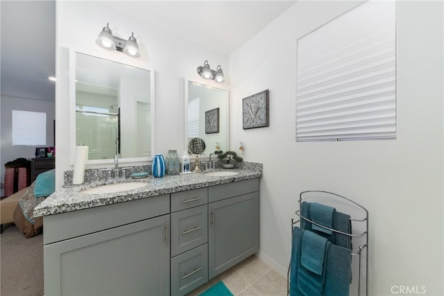 bathroom with vanity and tile patterned flooring