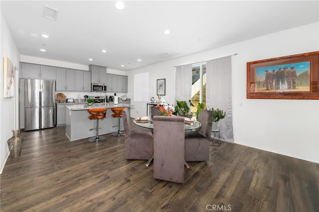 dining room with dark wood-type flooring