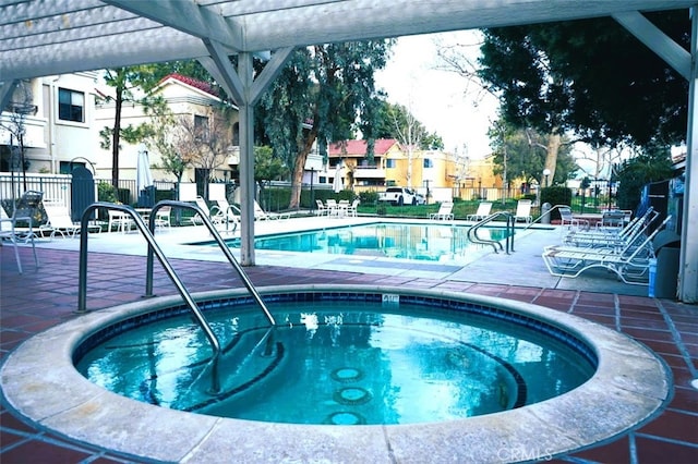 view of pool featuring a community hot tub