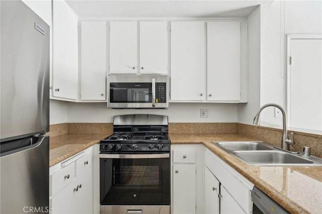 18808 Mandan St Unit 312, Canyon Country, CA 91351 - kitchen featuring light countertops, a sink, white cabinets, and stainless steel appliances