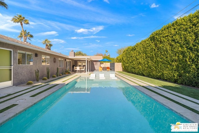 view of swimming pool featuring a patio