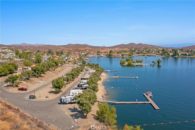 birds eye view of property featuring a water and mountain view