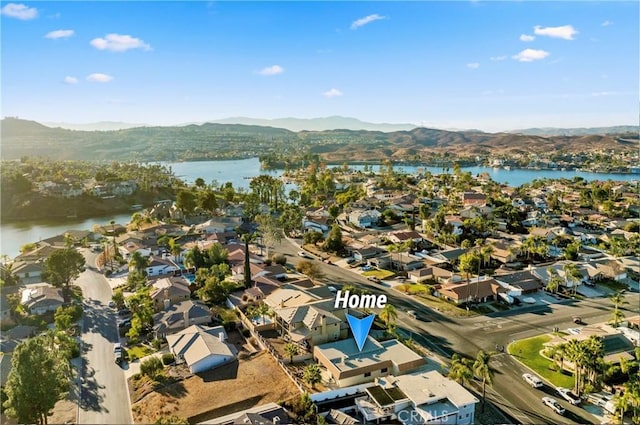 bird's eye view featuring a residential view and a water and mountain view