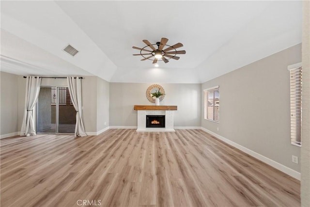 unfurnished living room with light wood-style floors, baseboards, and visible vents