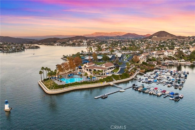 bird's eye view with a water and mountain view